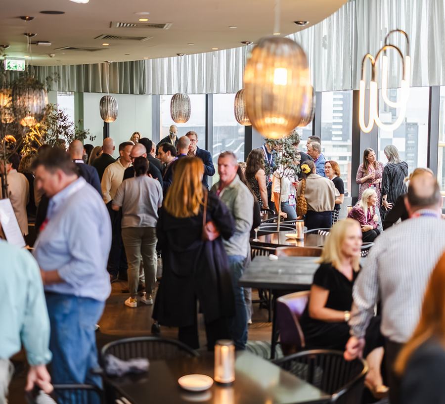 Delegates talking over drinks at the NEDC welcome reception