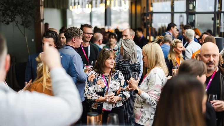 Delegates networking in the conference foyer